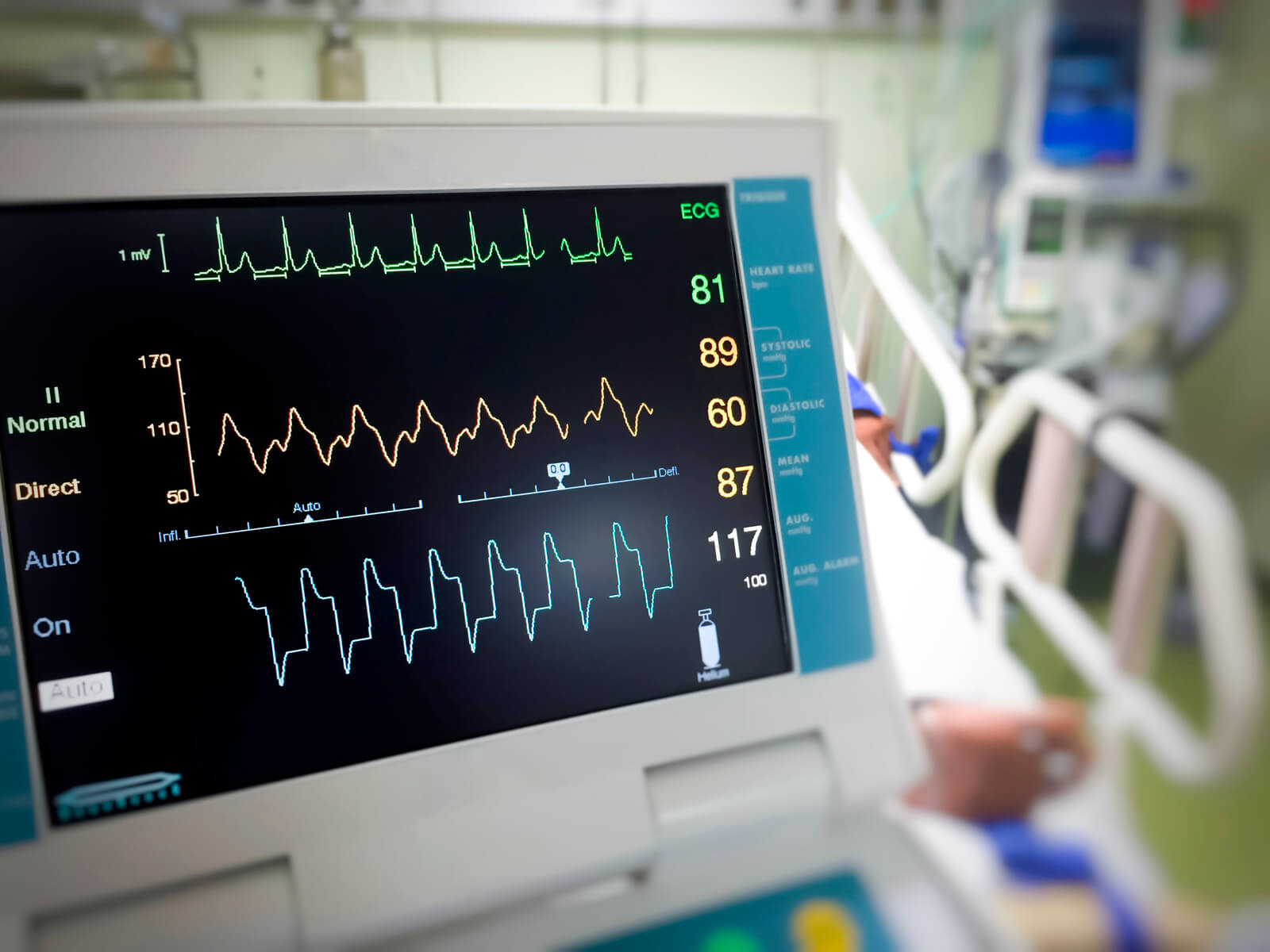 close up life support machine in front of a hospital bed