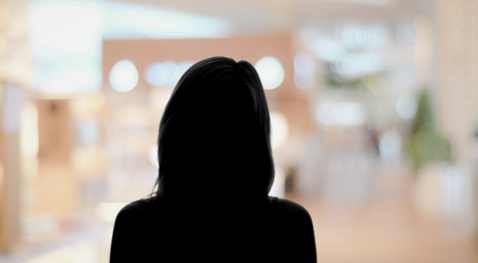 grey animated silhouette of a female in a suit
