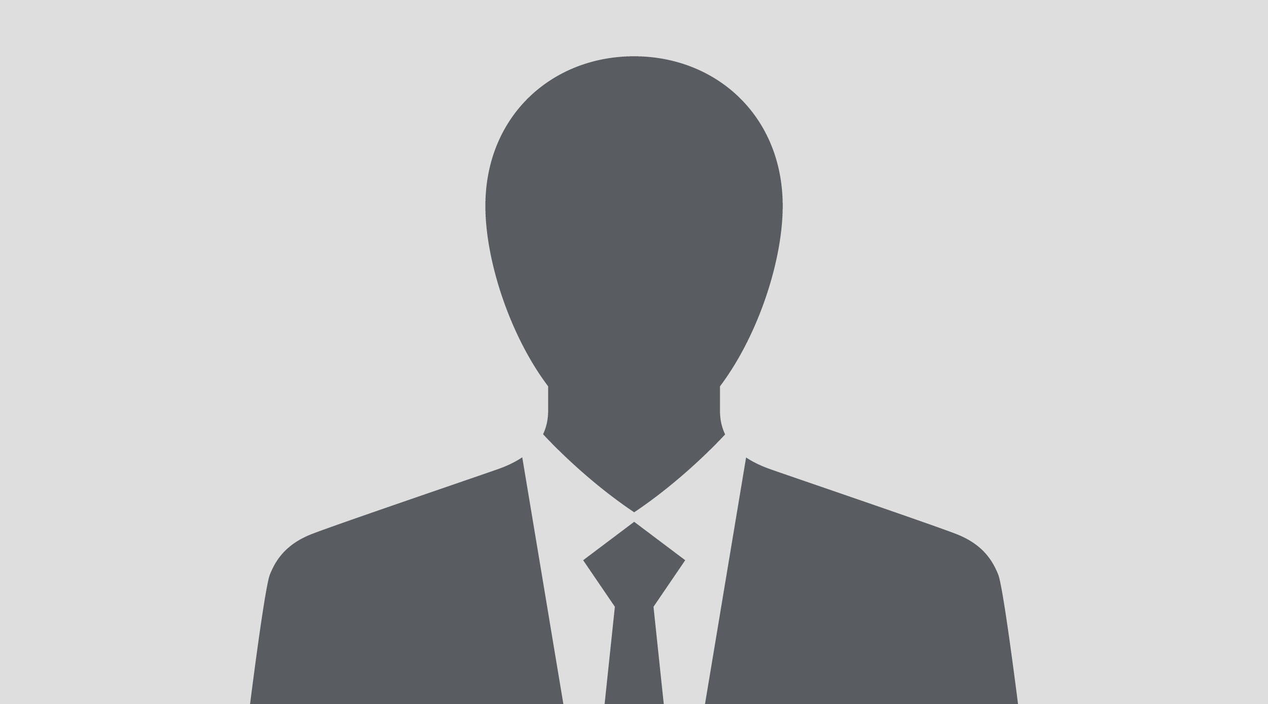 A silhouette of a man in a tie and jacket