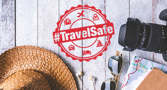 Sun hat, map, camera, sunglasses for a road trip