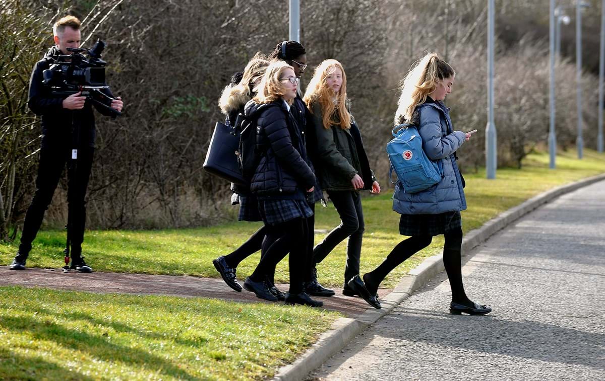 Milly Ogden, the lead actor in the film , stepping out into the road