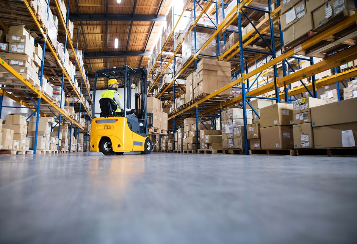 Forklift truck in operation in warehouse