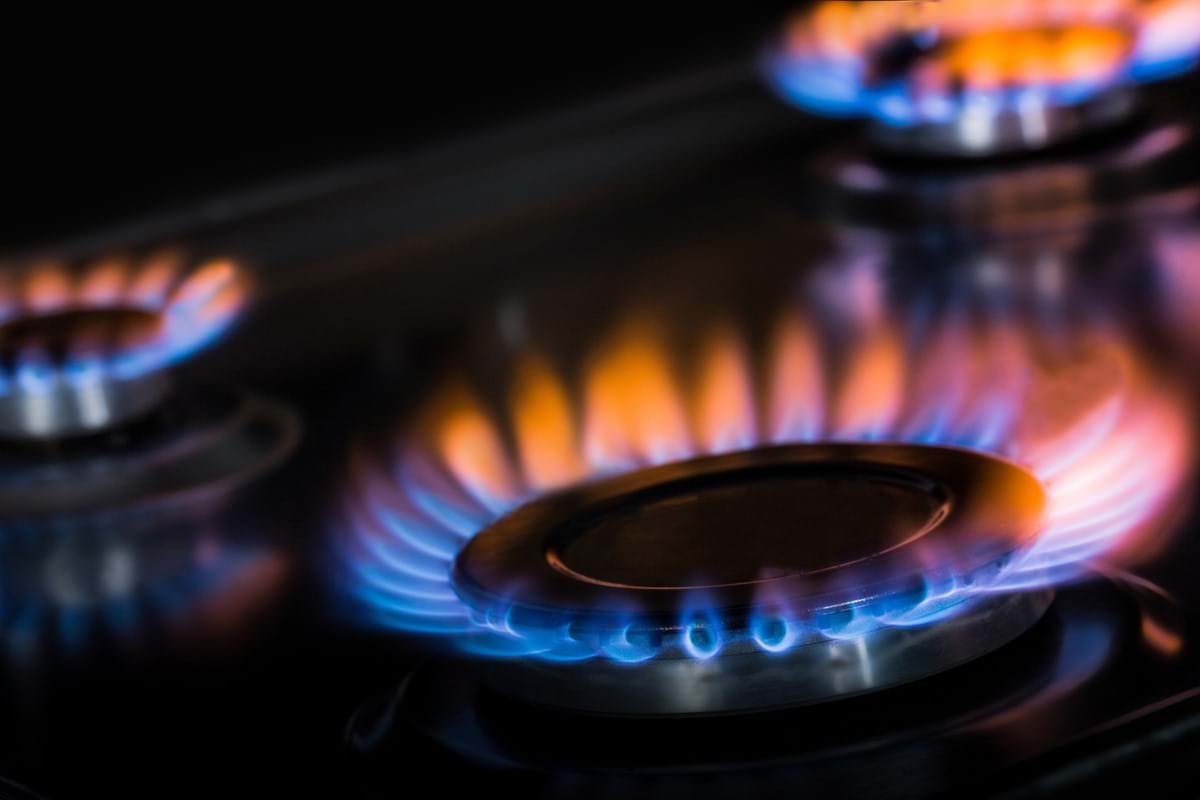 blue and orange naked hob flame