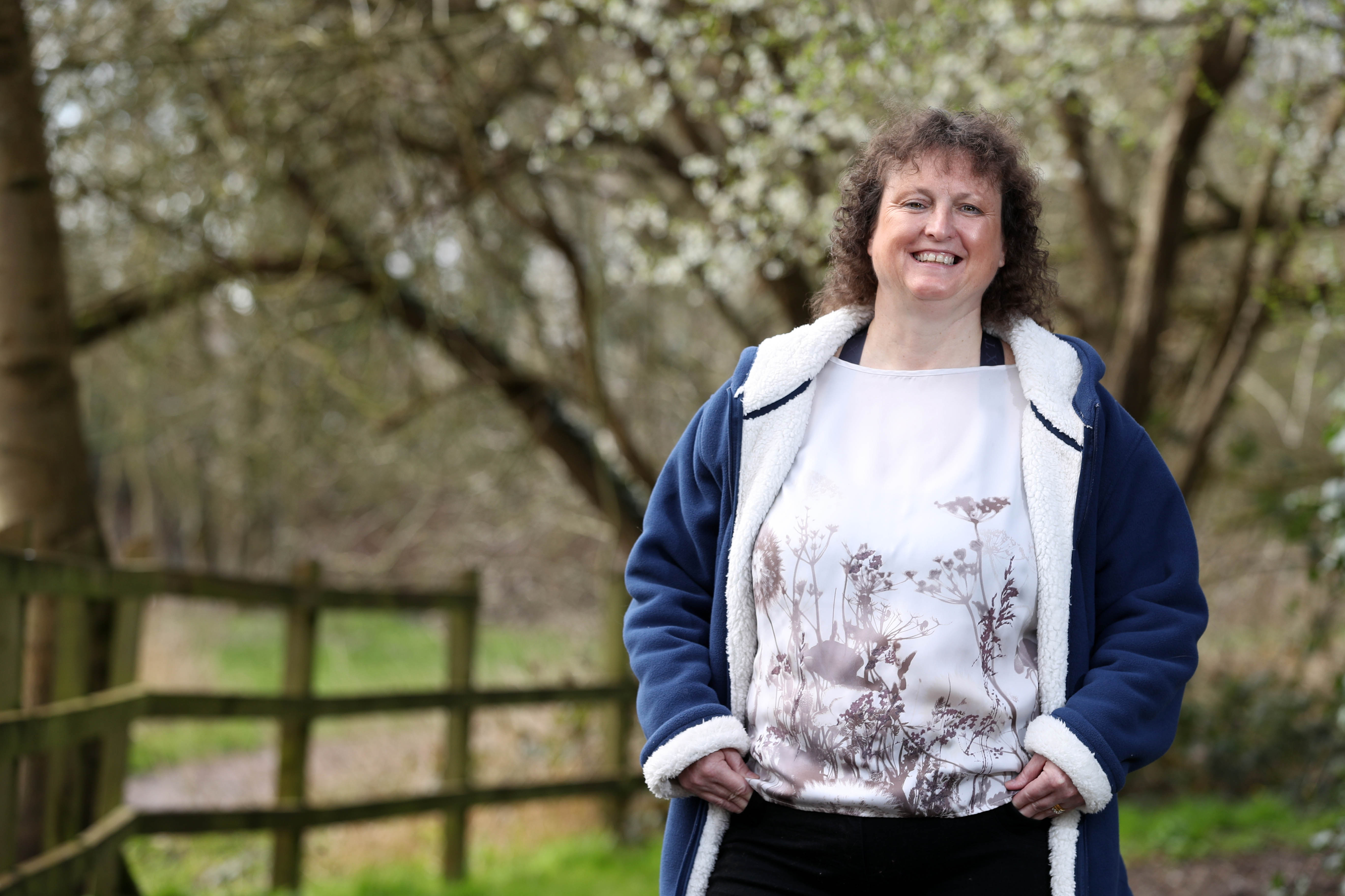 an image of a woman smiling outside
