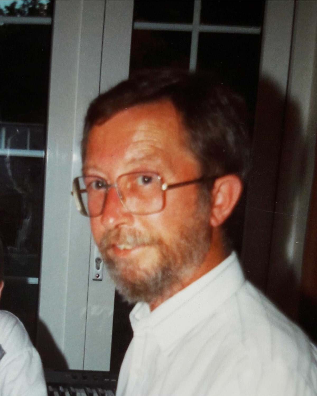 A photo of James Deacon looking at the camera