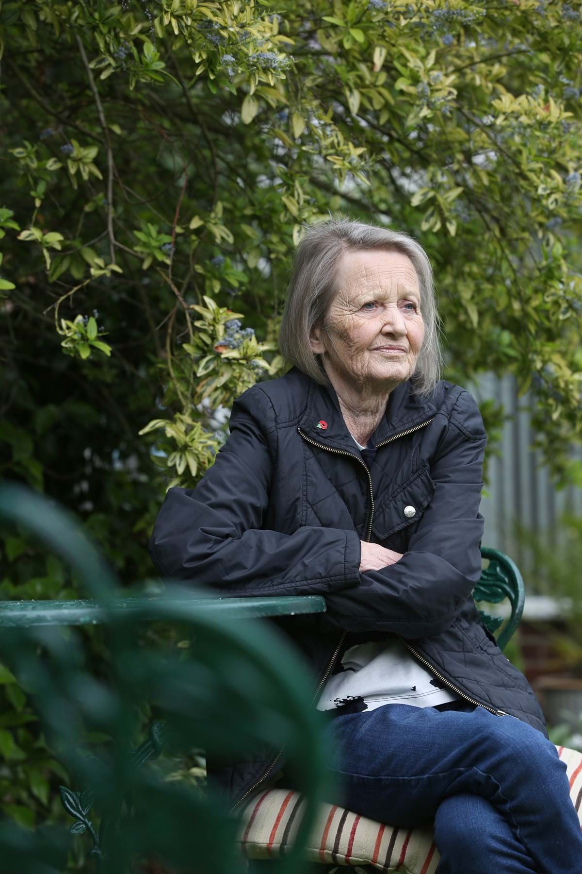 woman sat amongst trees