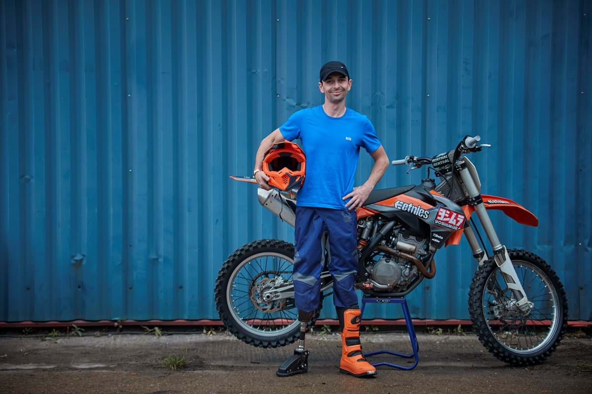 Damien next to his bike