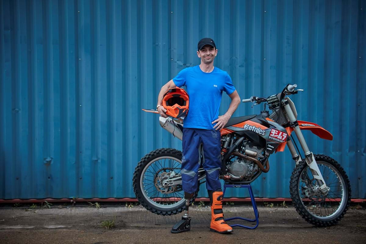 Damien next to his bike