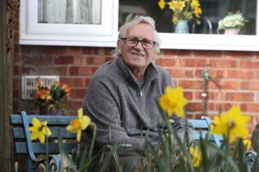 Anthony, our mesothelioma compensation client, sits outside his home