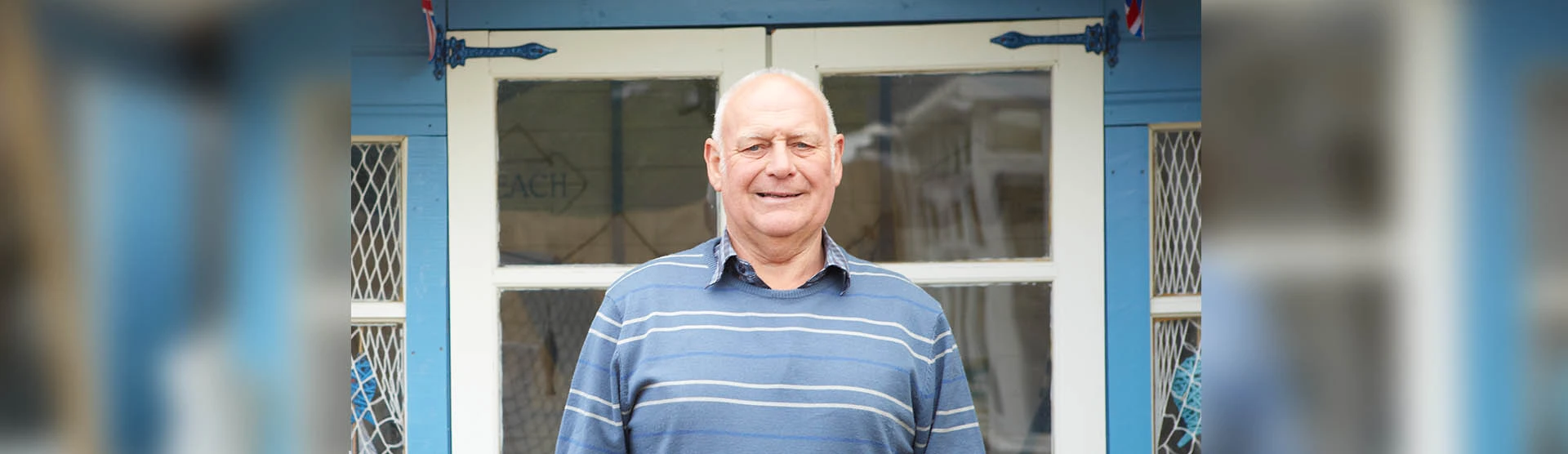 Roy, our personal injury slips trips and falls client, standing outside his home. 