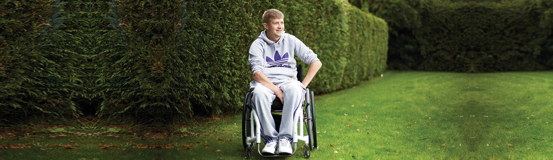 Mark, our spinal cord injury client, outside in his garden. 