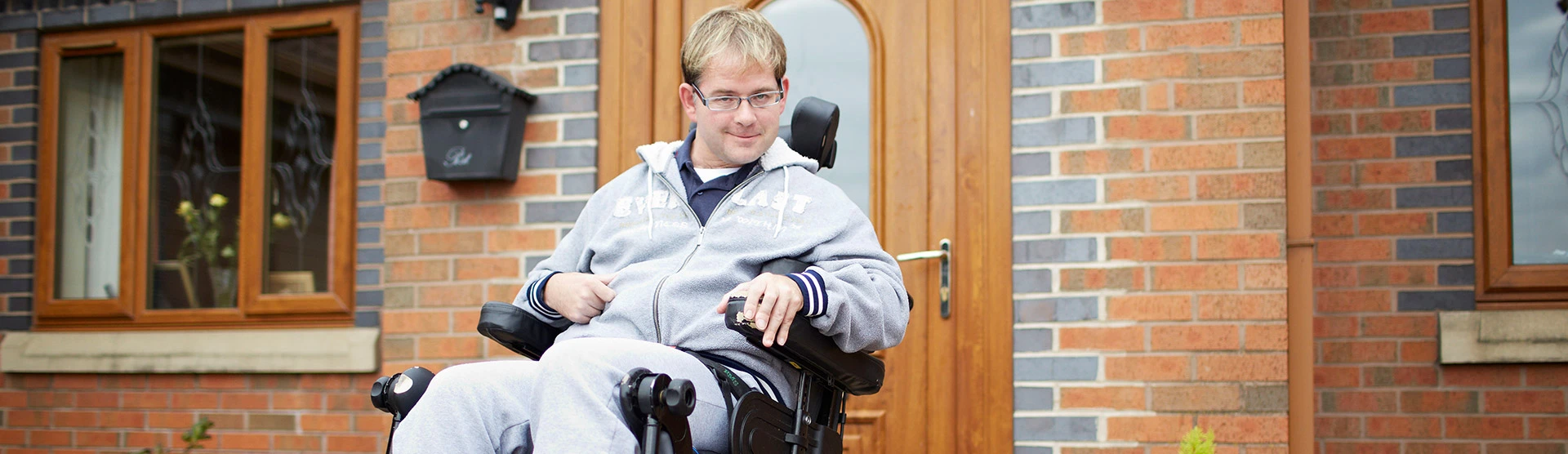 Patrick, our brain injury client, outside his front door. 