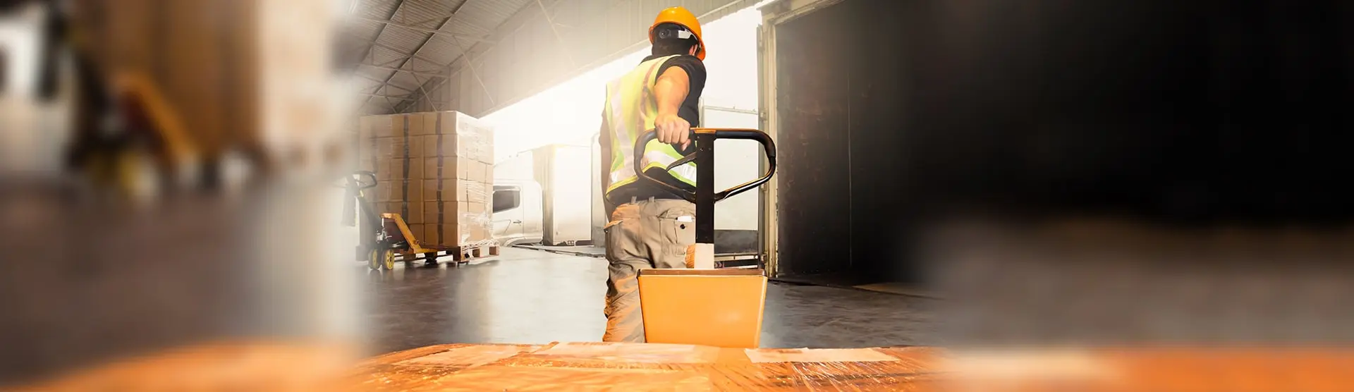 A man in a warehouse, representing our orthopaedic claims clients.