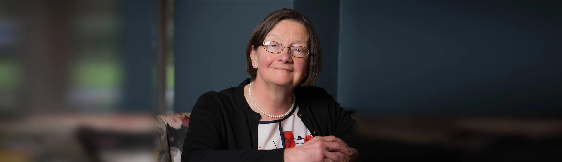 Judith, our cancer misdiagnosis client, smiling at the camera.